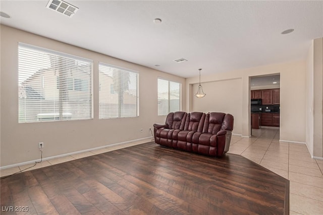 9221 Thunder Falls Ct, Las Vegas, NV 89149 - living area featuring baseboards and light tile patterned floors