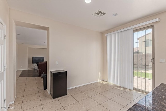 9221 Thunder Falls Ct, Las Vegas, NV 89149 - spare room with light tile patterned floors and plenty of natural light