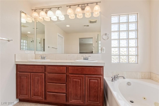 9221 Thunder Falls Ct, Las Vegas, NV 89149 - bathroom with double vanity and a tub with jets