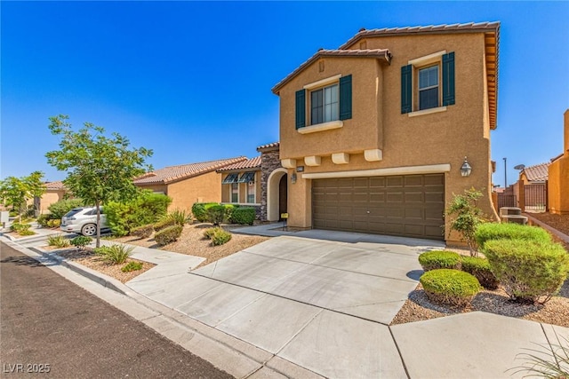 9221 Thunder Falls Ct, Las Vegas, NV 89149 - mediterranean / spanish home with stucco siding, a garage, concrete driveway, and a tiled roof