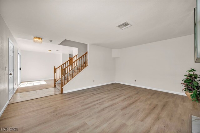3448 Twilight Star Dr, Las Vegas, NV 89117 - unfurnished living room with wood finished floors and stairs