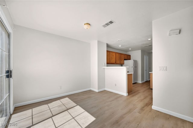 3448 Twilight Star Dr, Las Vegas, NV 89117 - unfurnished living room with light wood-style flooring and recessed lighting