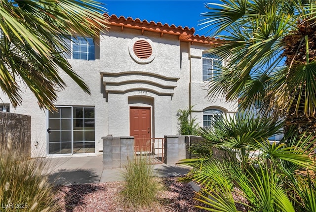 3448 Twilight Star Dr, Las Vegas, NV 89117 - property entrance with stucco siding and a tiled roof
