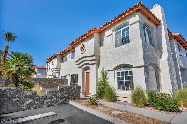 3448 Twilight Star Dr, Las Vegas, NV 89117 - mediterranean / spanish home with a tile roof, stucco siding, and a chimney