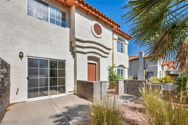 3448 Twilight Star Dr, Las Vegas, NV 89117 - property entrance with a tile roof and stucco siding
