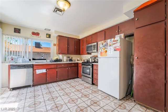 2297 Casey Dr, Las Vegas, NV 89119 - kitchen featuring appliances with stainless steel finishes and light countertops