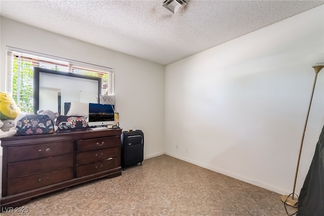 2297 Casey Dr, Las Vegas, NV 89119 - bedroom featuring multiple windows and a textured ceiling
