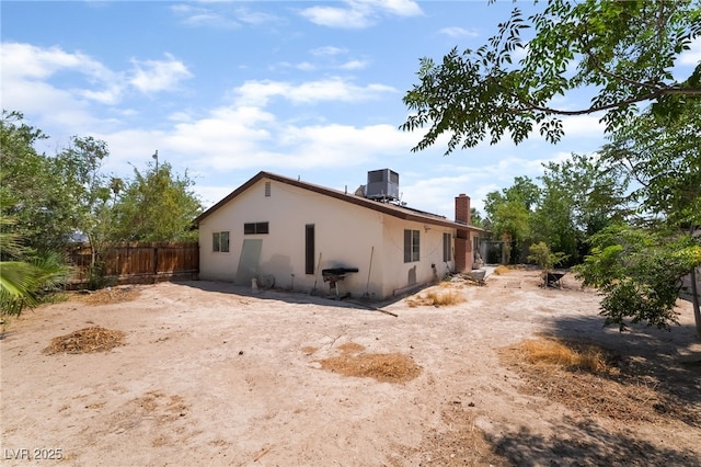 2297 Casey Dr, Las Vegas, NV 89119 - view of home's exterior with a chimney and stucco siding
