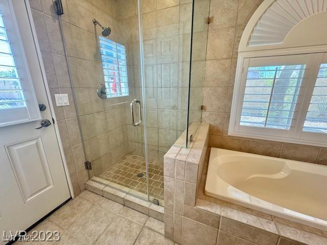 3197 Dusty Moon Ave, Henderson, NV 89052 - full bathroom with a garden tub, a shower stall, and tile patterned floors