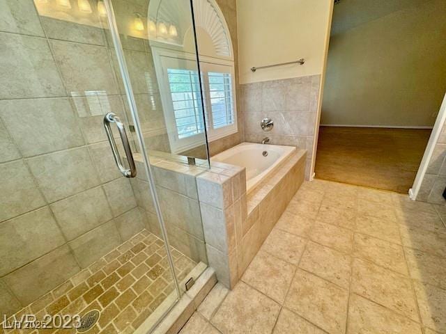 3197 Dusty Moon Ave, Henderson, NV 89052 - full bathroom with a stall shower, a bath, and tile patterned flooring