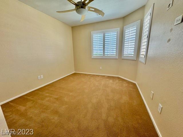 3197 Dusty Moon Ave, Henderson, NV 89052 - empty room featuring ceiling fan and carpet