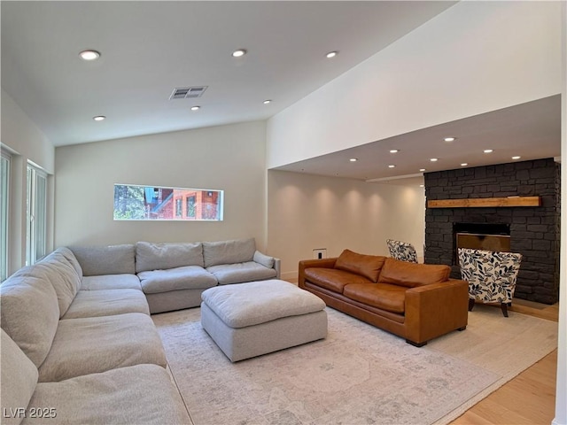 4651 Aspen Ave, Mount Charleston, NV 89124 - living area featuring light wood-type flooring, recessed lighting, a fireplace, and high vaulted ceiling