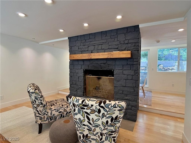 4651 Aspen Ave, Mount Charleston, NV 89124 - sitting room with light wood-type flooring, a stone fireplace, and recessed lighting
