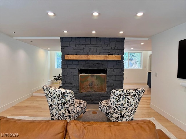 4651 Aspen Ave, Mount Charleston, NV 89124 - living room with a fireplace, light wood-style flooring, recessed lighting, and arched walkways