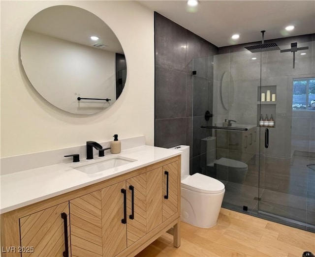 4651 Aspen Ave, Mount Charleston, NV 89124 - bathroom featuring vanity, a shower stall, wood finished floors, and recessed lighting