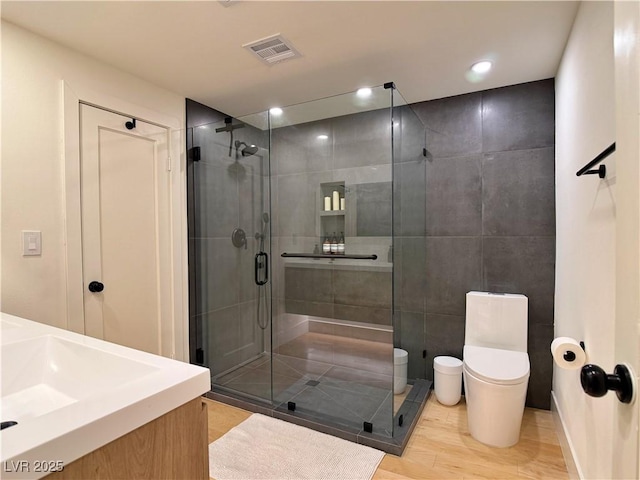 4651 Aspen Ave, Mount Charleston, NV 89124 - bathroom with a stall shower, wood finished floors, vanity, and recessed lighting