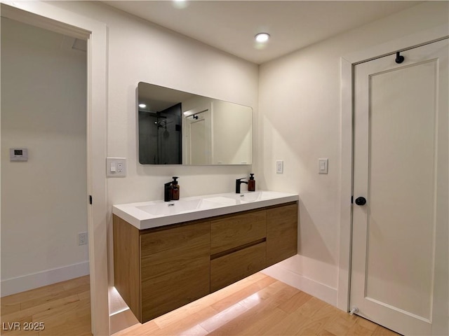 4651 Aspen Ave, Mount Charleston, NV 89124 - full bath featuring double vanity, wood finished floors, and recessed lighting