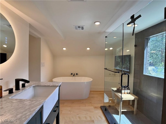 4651 Aspen Ave, Mount Charleston, NV 89124 - bathroom featuring vanity, a shower stall, a soaking tub, and recessed lighting