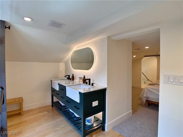 4651 Aspen Ave, Mount Charleston, NV 89124 - full bathroom with double vanity, lofted ceiling, ensuite bath, recessed lighting, and wood finished floors
