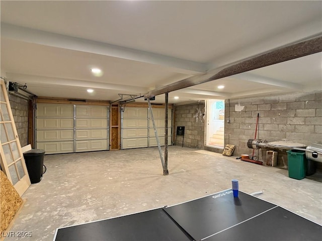 4651 Aspen Ave, Mount Charleston, NV 89124 - garage with a garage door opener, concrete block wall, and recessed lighting