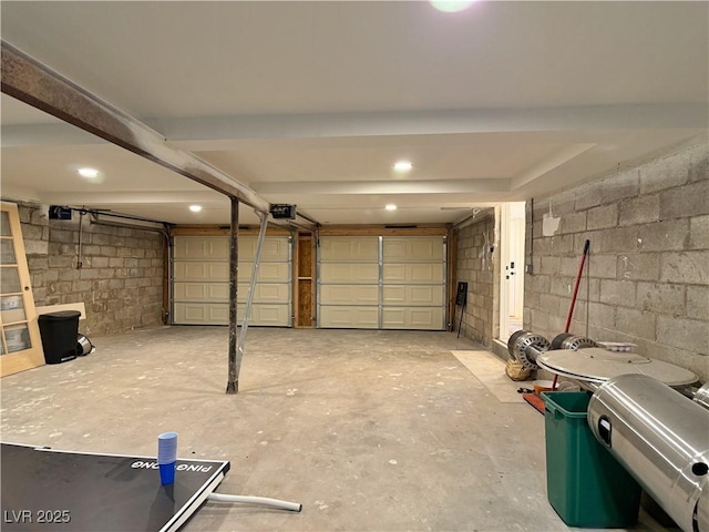 4651 Aspen Ave, Mount Charleston, NV 89124 - garage with concrete block wall and a garage door opener