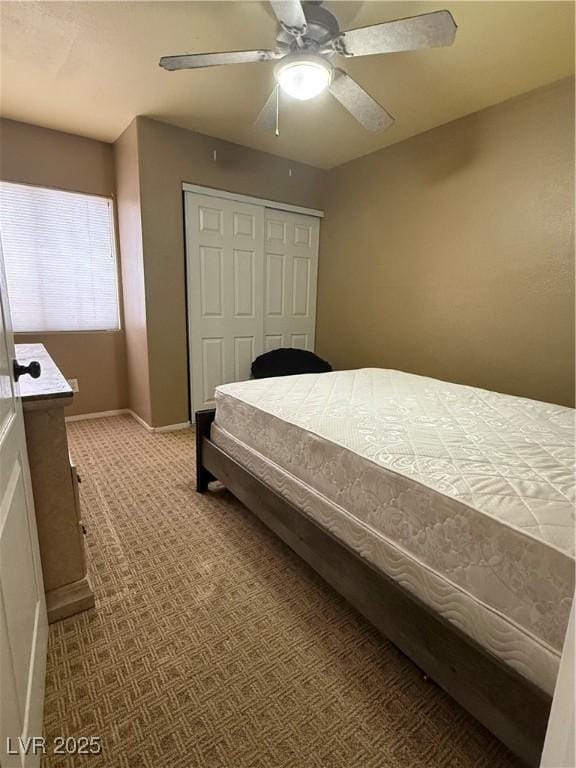 5315 Debut Ct, North Las Vegas, NV 89031 - carpeted bedroom with a closet and a ceiling fan