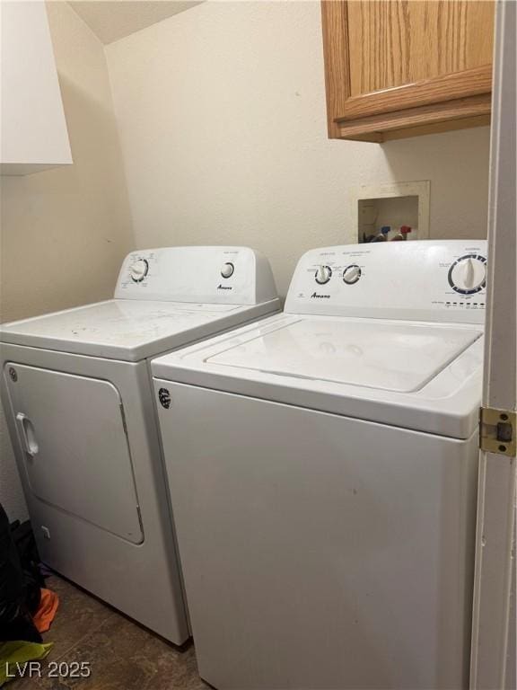 5315 Debut Ct, North Las Vegas, NV 89031 - laundry area with cabinet space and washing machine and dryer