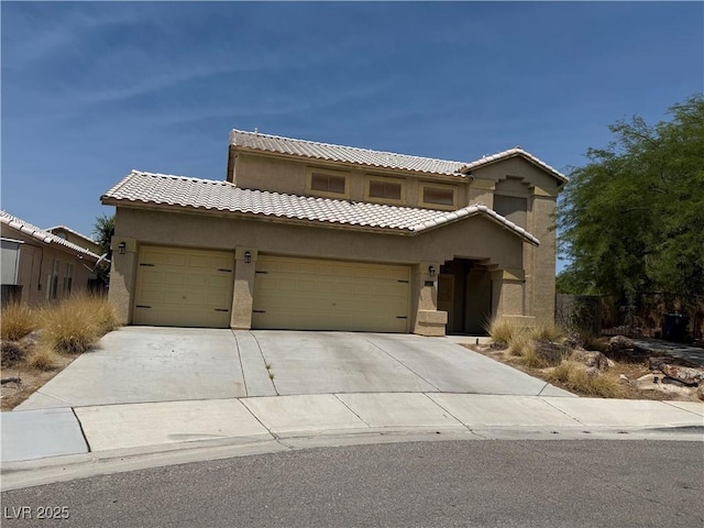 5315 Debut Ct, North Las Vegas, NV 89031 - view of front facade with a garage, stucco siding, driveway, and a tile roof