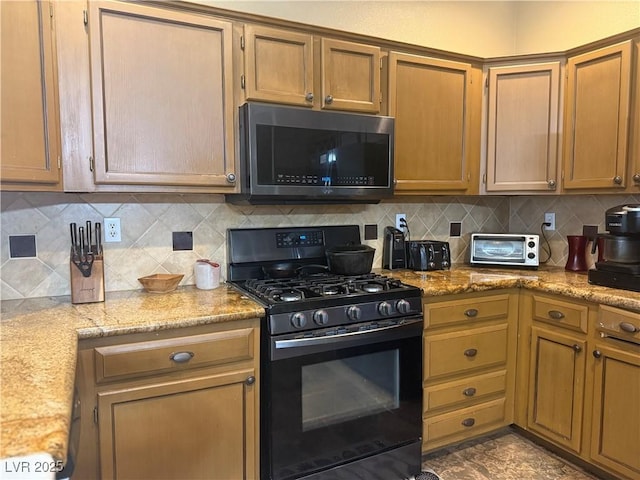 5315 Debut Ct, North Las Vegas, NV 89031 - kitchen with black gas range, tasteful backsplash, light stone counters, and brown cabinets