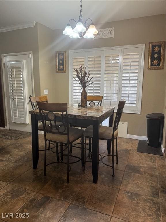 5315 Debut Ct, North Las Vegas, NV 89031 - dining area featuring a chandelier, crown molding, and dark stone finish floors