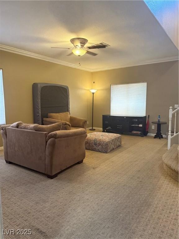 5315 Debut Ct, North Las Vegas, NV 89031 - carpeted living room featuring ornamental molding and ceiling fan
