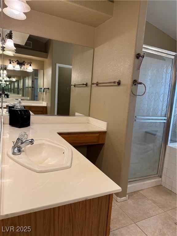 5315 Debut Ct, North Las Vegas, NV 89031 - full bathroom featuring tile patterned floors, vanity, and a stall shower