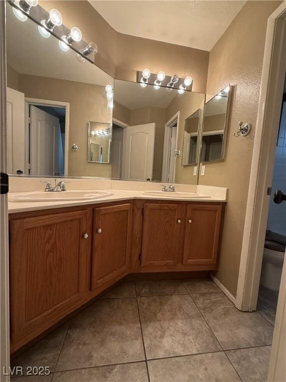 5315 Debut Ct, North Las Vegas, NV 89031 - full bathroom with double vanity and tile patterned floors