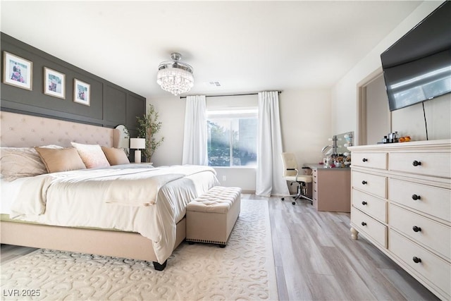 10183 Cascadia Creek St, Las Vegas, NV 89141 - bedroom featuring light wood-style floors, a chandelier, and an office area