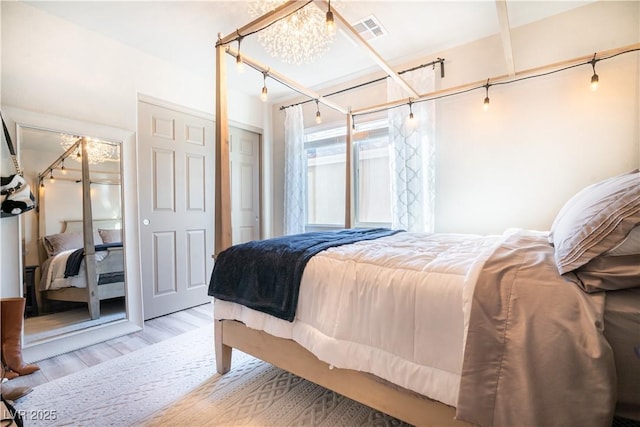 10183 Cascadia Creek St, Las Vegas, NV 89141 - bedroom with wood finished floors and a chandelier