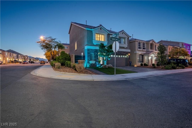 10183 Cascadia Creek St, Las Vegas, NV 89141 - view of front of home featuring stucco siding, a residential view, a garage, a tiled roof, and stone siding
