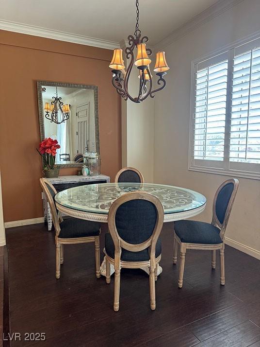 2405 Serene Ave Unit 241, Las Vegas, NV 89123 - dining room featuring a chandelier, crown molding, and dark wood-style floors