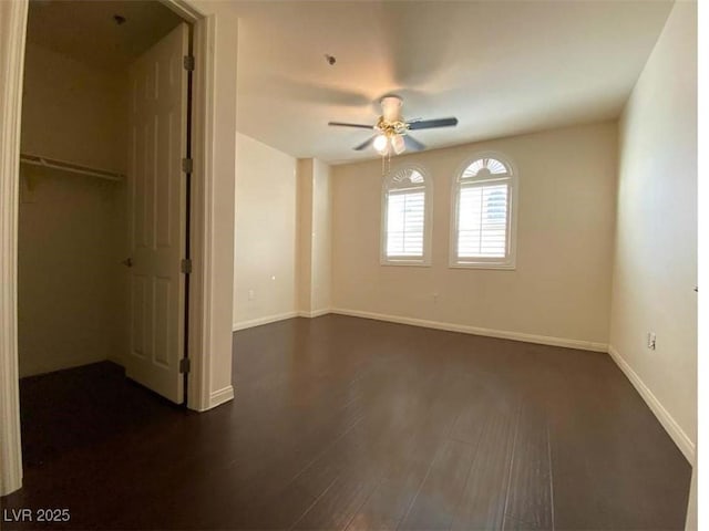 2405 Serene Ave Unit 241, Las Vegas, NV 89123 - unfurnished bedroom with dark wood-style flooring and ceiling fan