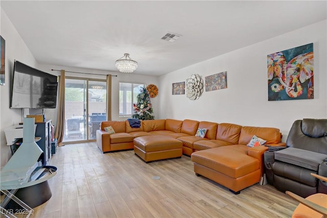 6324 Conlon St, North Las Vegas, NV 89081 - living area featuring light wood-style flooring and a chandelier