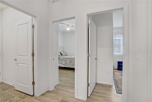 6324 Conlon St, North Las Vegas, NV 89081 - hall featuring light wood-style flooring and baseboards