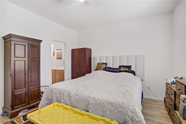 6324 Conlon St, North Las Vegas, NV 89081 - bedroom with light wood-style floors, ensuite bath, and a ceiling fan