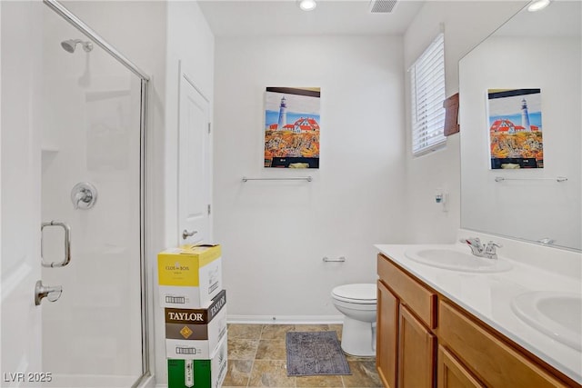 6324 Conlon St, North Las Vegas, NV 89081 - bathroom with a shower stall, double vanity, and recessed lighting