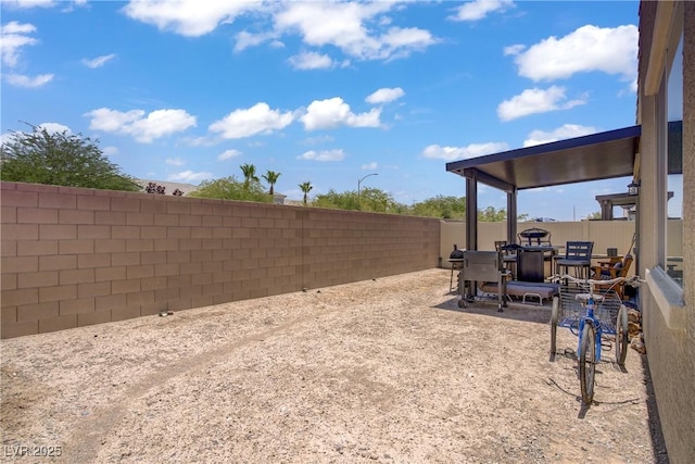6324 Conlon St, North Las Vegas, NV 89081 - fenced backyard featuring outdoor dining space and a patio
