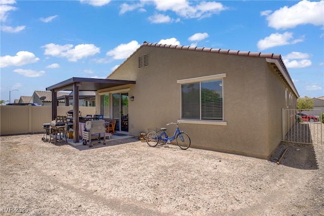 6324 Conlon St, North Las Vegas, NV 89081 - rear view of property with a patio area and stucco siding