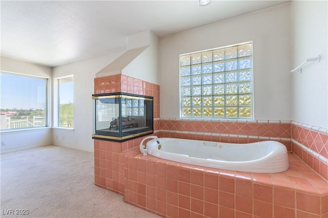 2019 Doral Ct, Henderson, NV 89074 - bathroom featuring a garden tub and a tiled fireplace