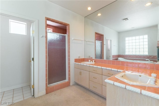 2019 Doral Ct, Henderson, NV 89074 - bathroom with a shower stall, double vanity, a bath, recessed lighting, and tile patterned floors