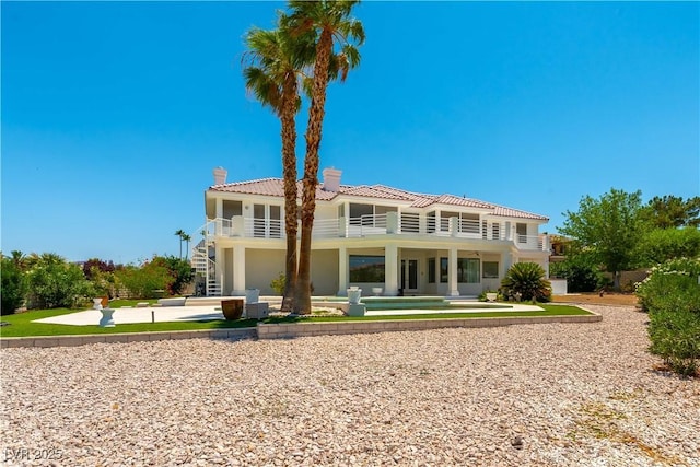 2019 Doral Ct, Henderson, NV 89074 - back of property featuring a patio, a chimney, a tiled roof, and stucco siding