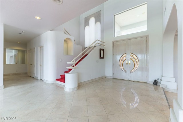 2019 Doral Ct, Henderson, NV 89074 - entryway with stairway, a high ceiling, and arched walkways