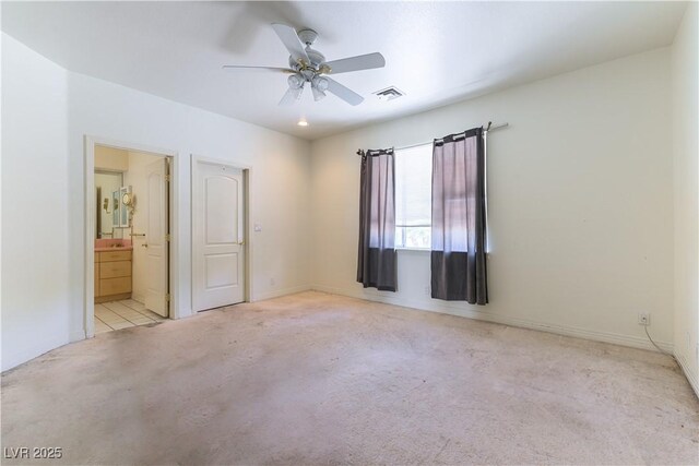 2019 Doral Ct, Henderson, NV 89074 - unfurnished bedroom with carpet flooring, ensuite bathroom, and a ceiling fan