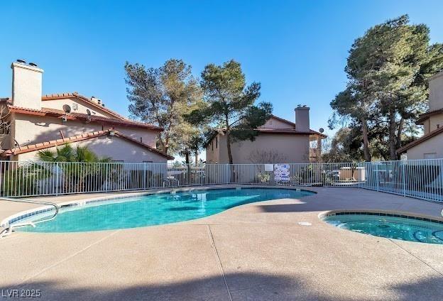 805 Rock Springs Dr Unit 101, Las Vegas, NV 89128 - community pool with a patio and a community hot tub